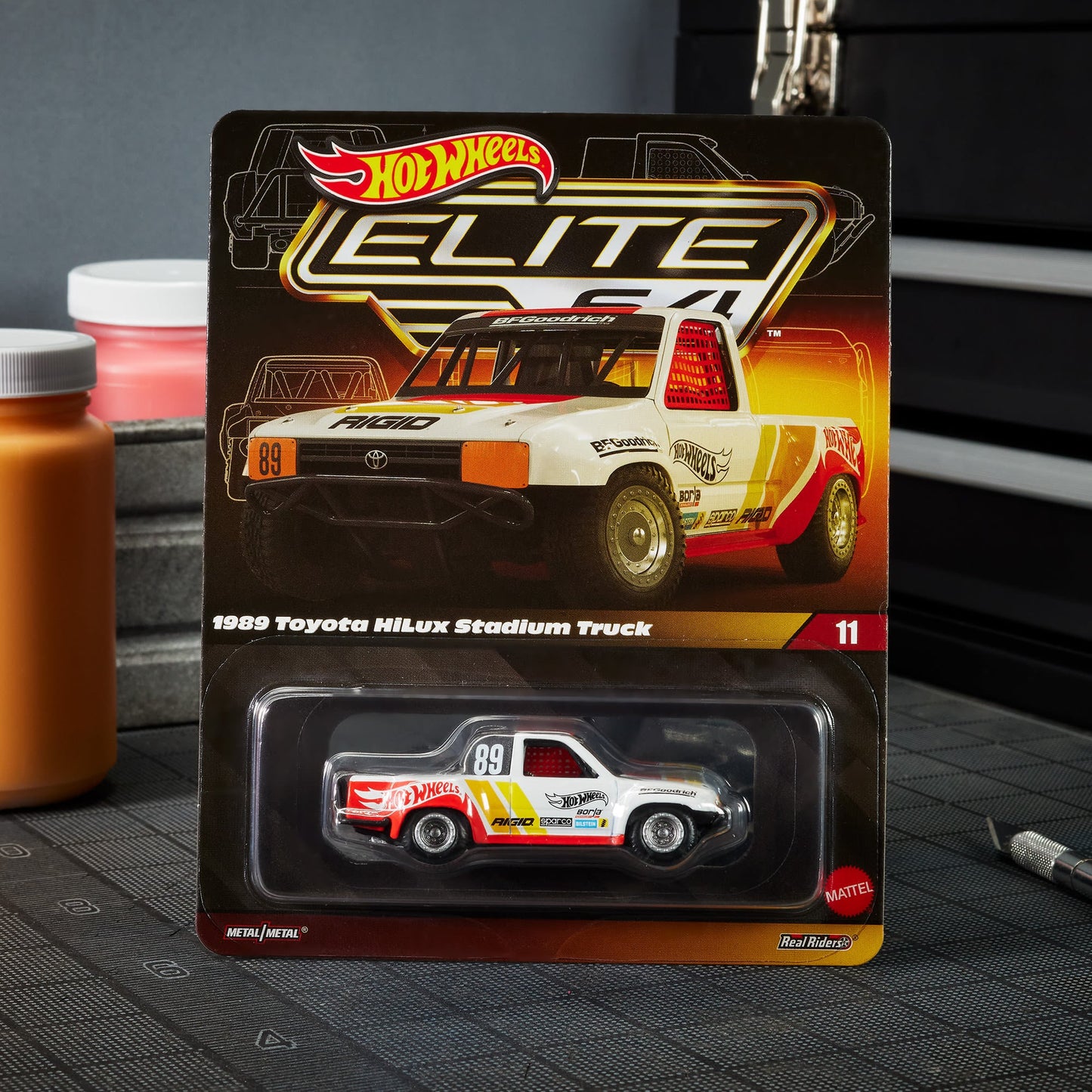 Hot Wheels Elite 64 1989 Toyota HiLux Stadium Truck - Xe Mô Hình Tỷ Lệ 1:64 Cao Cấp - Hot Wheels